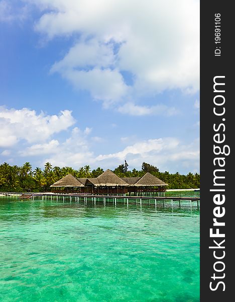 Water cafe on a tropical beach - Maldives travel background. Water cafe on a tropical beach - Maldives travel background