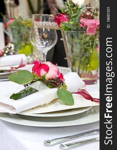 A Covered banquet with red roses decoration