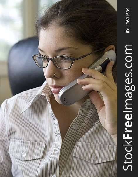 A young woman talking on a cell phone. A young woman talking on a cell phone