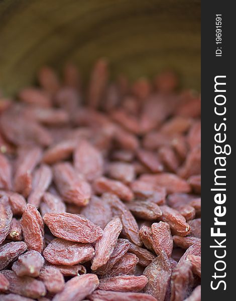 Closeup of Goji Berries in wooden bowl