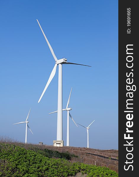 Photo of Wind power installation in sunny day