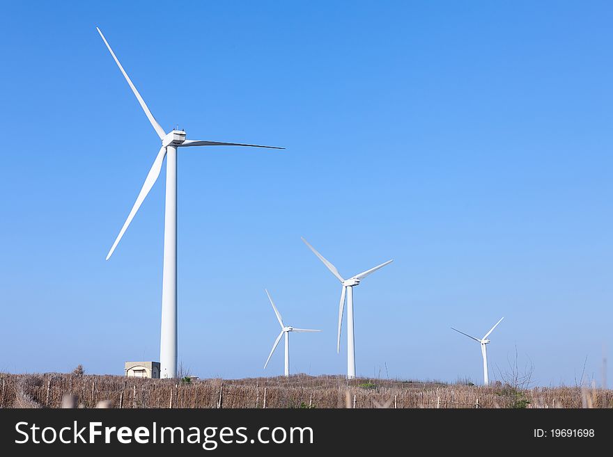 Photo Of Wind Power Installation In Sunny Day