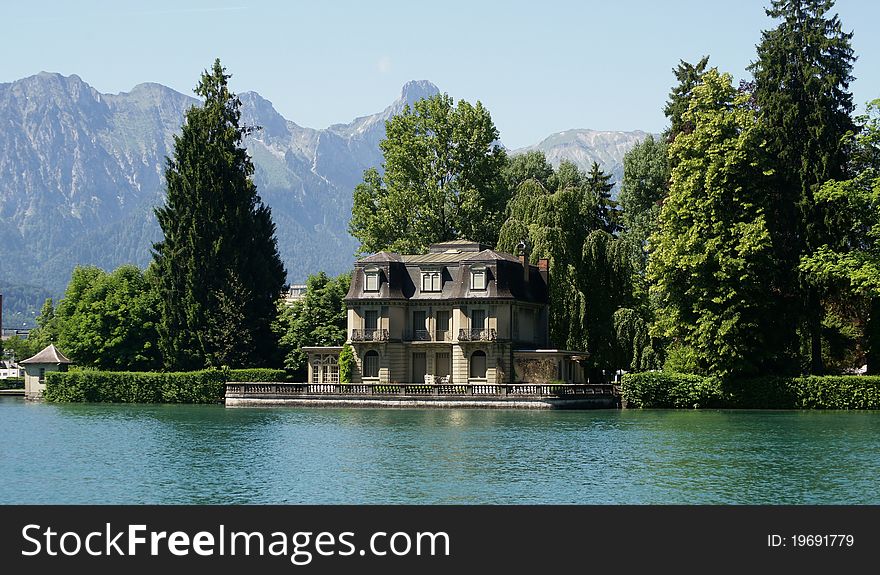 A mansion on the water right outside of the town of Thun, Switzerland. A mansion on the water right outside of the town of Thun, Switzerland.