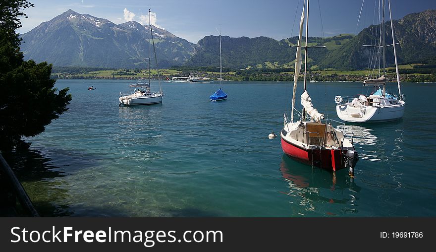 Some sailing boats near the shore of Lake Thun, Switzerland.