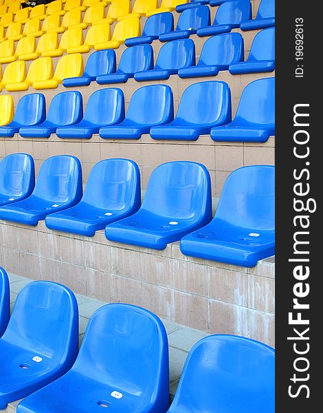 Stadium seats in blue and yellow color