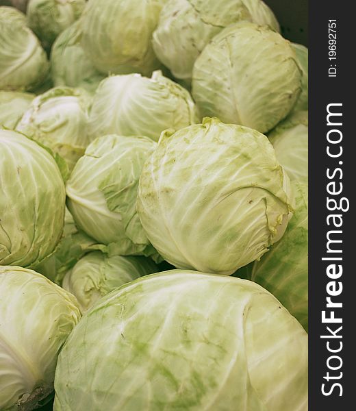 Group of cabbages in a stand supermarket. Group of cabbages in a stand supermarket