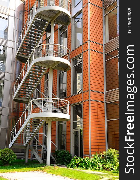 Those are steel stairs outside a modern building, forming interesting patterns. Those are steel stairs outside a modern building, forming interesting patterns.