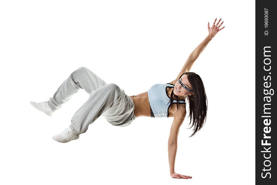 Cool looking dancer posing on a grey background. Cool looking dancer posing on a grey background