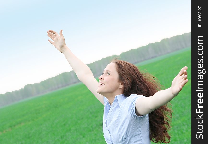 Girl walks in the field