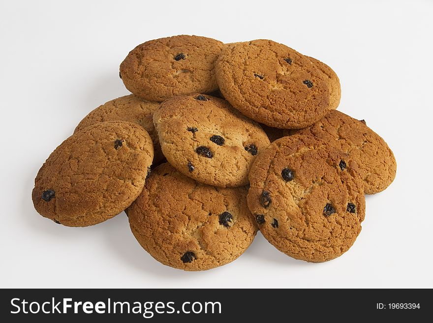 Group of oatmeal chip cookies with raisins on white background.