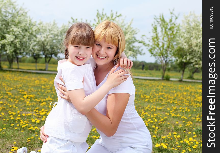 Girl with mother in spring park