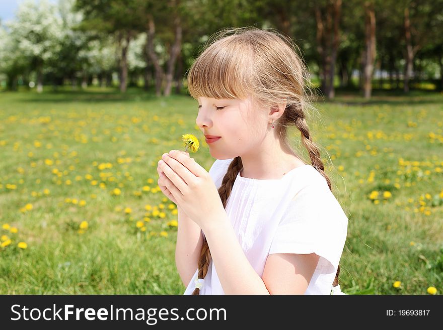 Little girl in white clothes in spring park. Little girl in white clothes in spring park