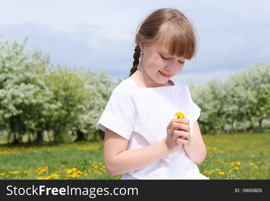 Little girl in white clothes in spring park. Little girl in white clothes in spring park