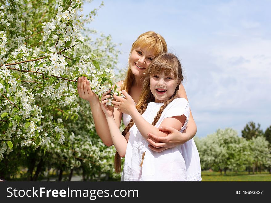 Girl With Mother In Spring Park