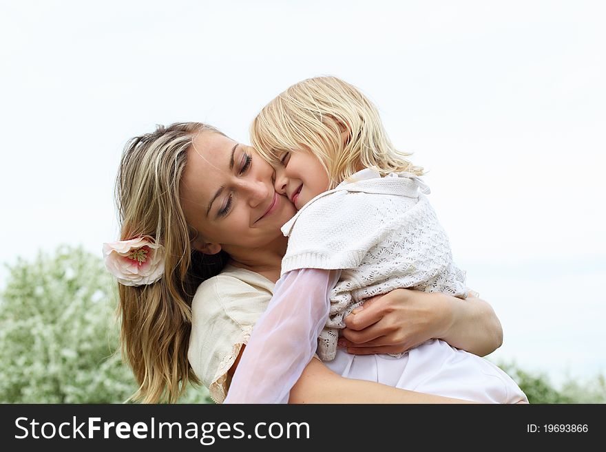 Girl with mother in the park