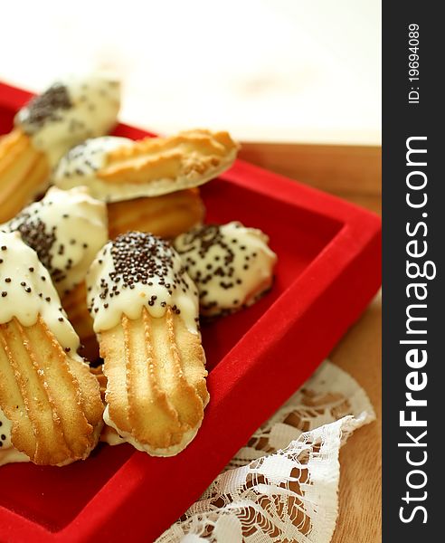 Cookies with black and white chocolate on red
