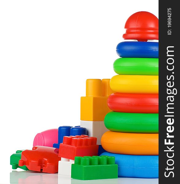 Colorful Plastic Toys And Bricks On White