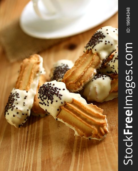 Cookies with black and white chocolate and cup on wooden. Cookies with black and white chocolate and cup on wooden