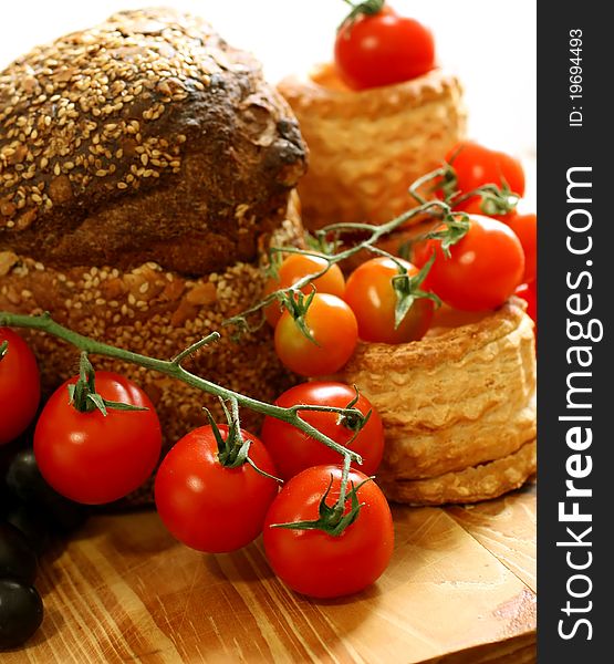 Tomatoes And Bread On Wooden