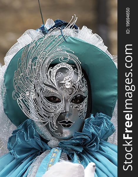 A portrait of one of the most beautiful masks photographed in open street during venetian carnival. A portrait of one of the most beautiful masks photographed in open street during venetian carnival.