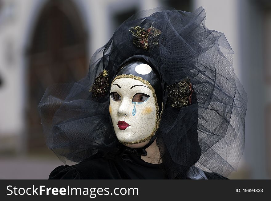 A portrait of one of the most beautiful masks photographed in open street during venetian carnival. A portrait of one of the most beautiful masks photographed in open street during venetian carnival.