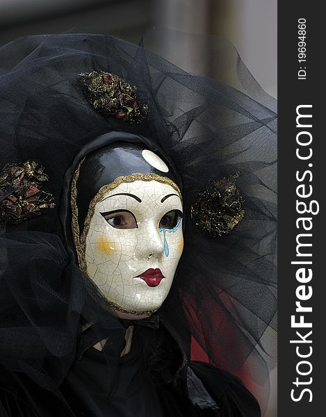 A portrait of one of the most beautiful masks photographed in open street during venetian carnival. A portrait of one of the most beautiful masks photographed in open street during venetian carnival.