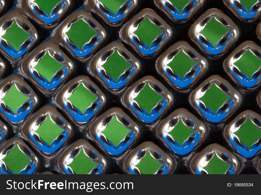 Grater detail with blue and green reflections
