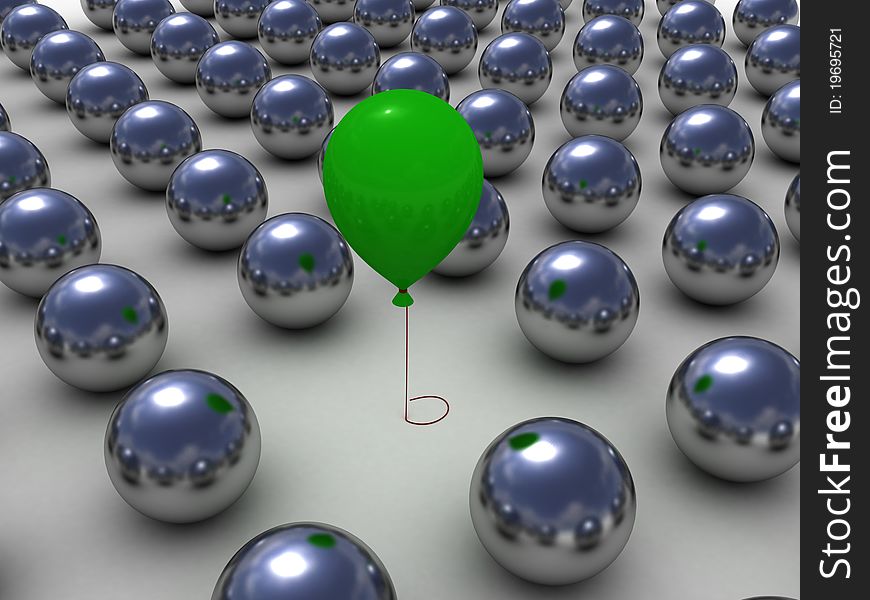 Green balloon among the shiny metallic balls