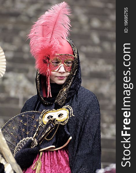 A portrait of one of the most beautiful masks photographed in open street during venetian carnival. A portrait of one of the most beautiful masks photographed in open street during venetian carnival.