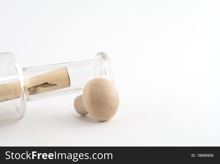 Bottle with message in it on white background. Bottle with message in it on white background