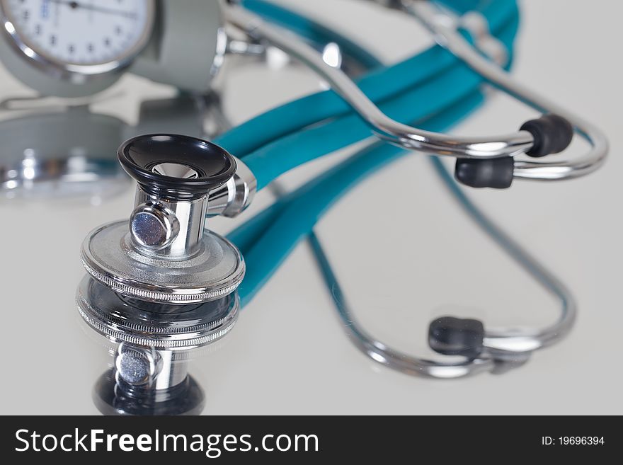 Stethoscope silver and Blue on Reflective background. Stethoscope silver and Blue on Reflective background