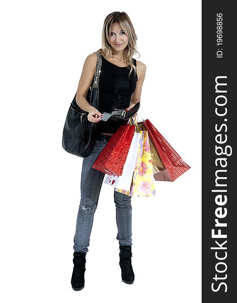 blond woman with shopping bags and her credit cards smiling happily. blond woman with shopping bags and her credit cards smiling happily