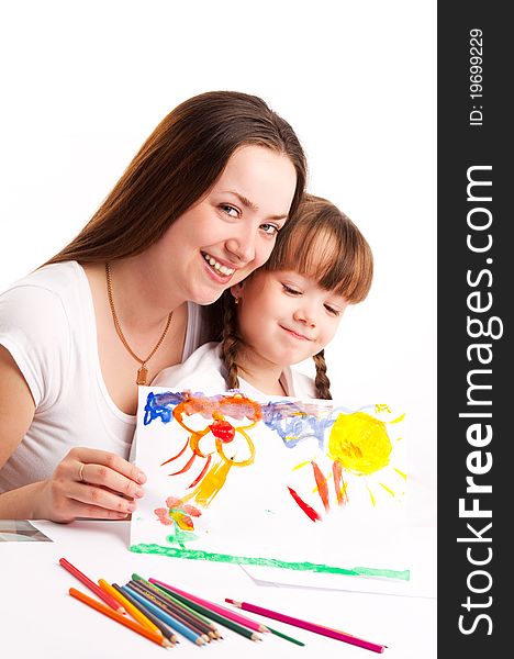 Young mother and her five year old daughter drawing with pencils and watercolor at home. Young mother and her five year old daughter drawing with pencils and watercolor at home