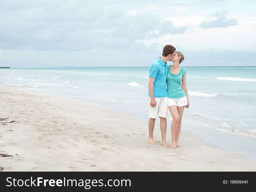 Happy Couple On The Beach