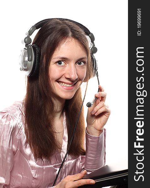 Smiling young woman with headphones and laptop