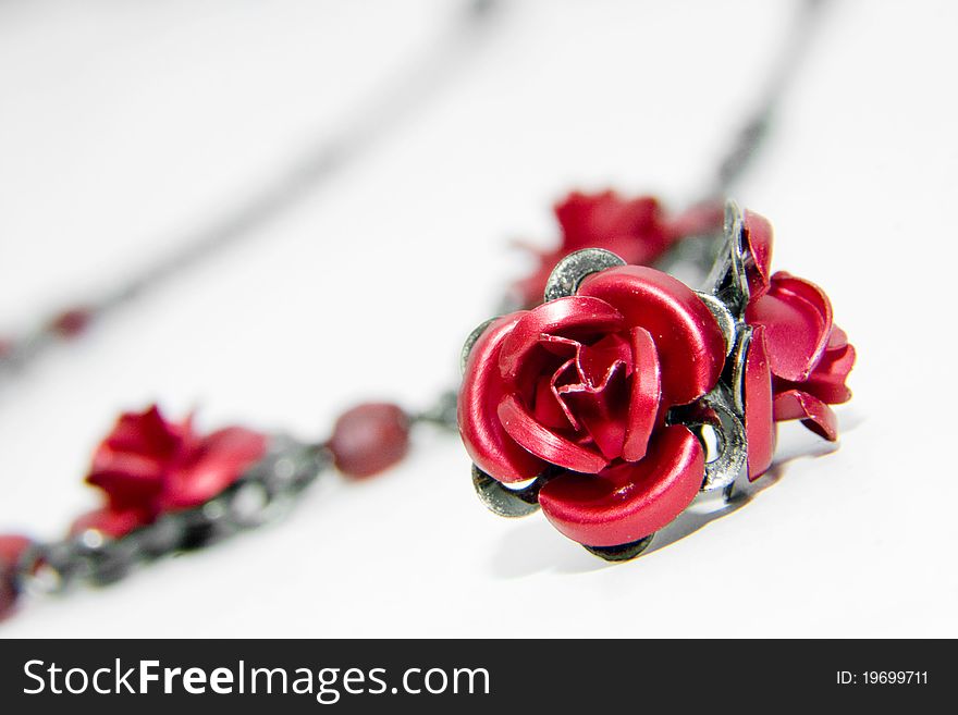 Red earrings on white background