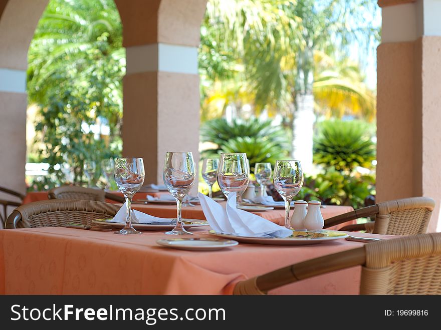 Restaurant interior with glasses on tables. Restaurant interior with glasses on tables