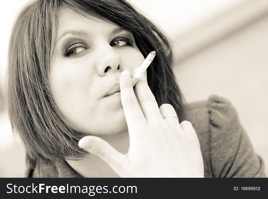 Young woman smoking cigarette