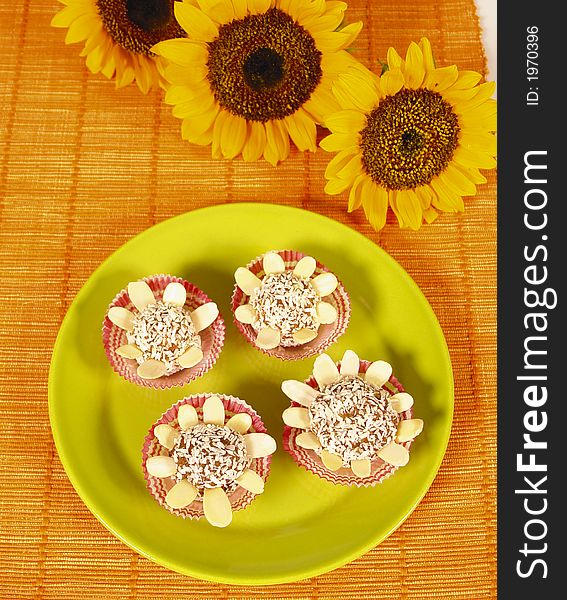 Cocount desert made from almonds and sunflower decoration. Cocount desert made from almonds and sunflower decoration