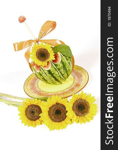 Carved watermelon with sunflower decoration. Carved watermelon with sunflower decoration