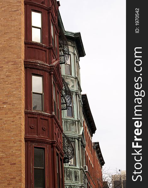 Multi colored buildings highlight this image of apartment buildings in the historic beacon hill area of boston