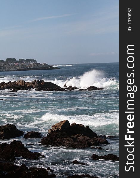 Waves crashing into rocks on Monterey Bay