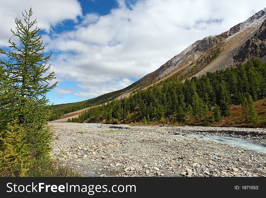 River, mountains and clouds.