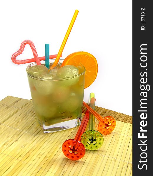 A colorful picture of a cocktail in a small glass with some decoration at the side. A colorful picture of a cocktail in a small glass with some decoration at the side