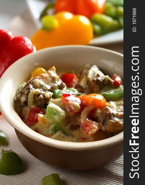 Tasty chicken with red, yellow and green pepper. Tasty chicken with red, yellow and green pepper