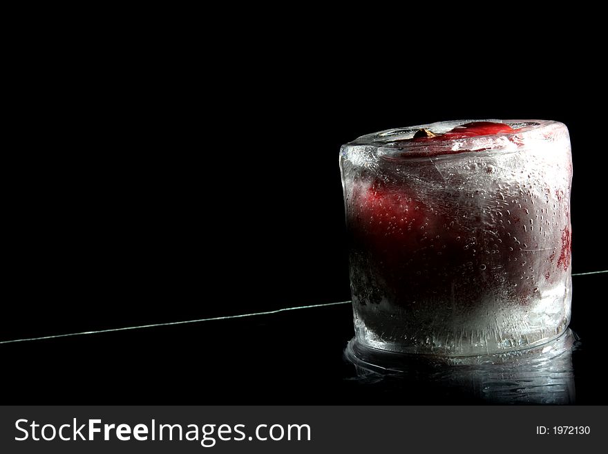 Frozen apple standing on reflection