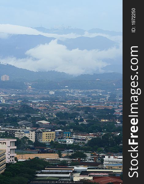 Small city landscape with a big resort city uphill