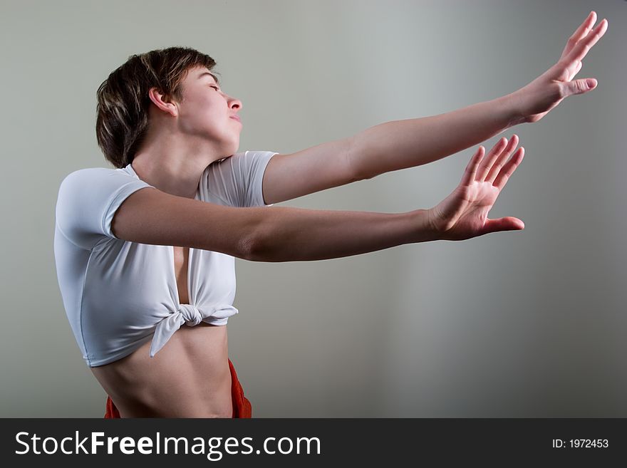 Attractive young woman doing exercises. With copy space