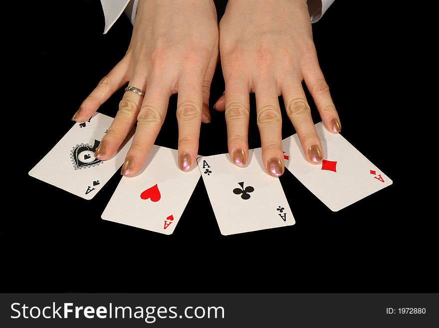 Four aces and female hands isolated on black. Four aces and female hands isolated on black