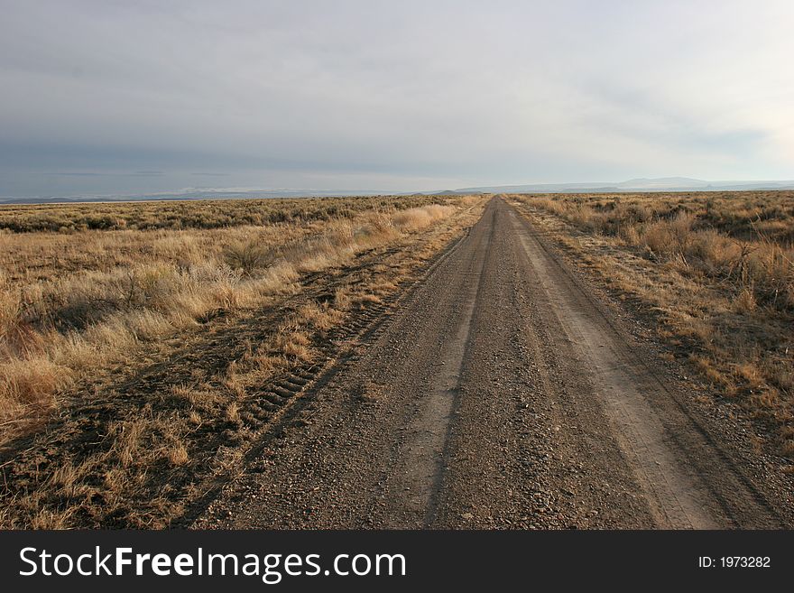 Gravel Road on a featureless landscape; clean, crisp, sharp image.